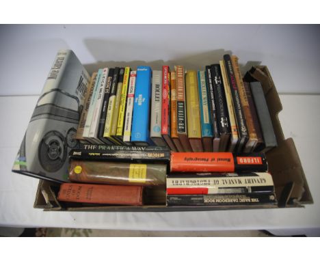 Collection of camera and photograghy related books including one first edition 1977  This assortment comprises multiple books