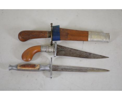 **Collection of Three Decorative Knives: Indian, Syrian, and Foreign with Dragon Motif**  This collection features three dist