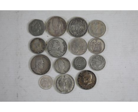 **Diverse Collection of 20th Century World Coins Including Egyptian, American, and Arabic Coins**  This unique collection fea