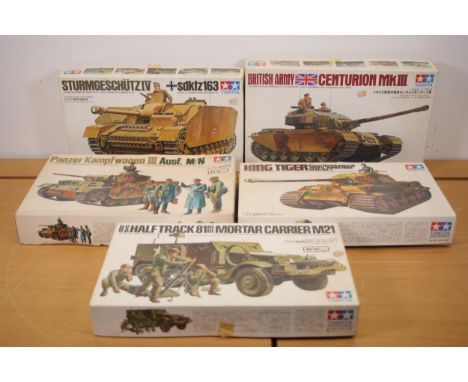 Tamiya 1/35 Scale Military Model Kits  This collection features five 1/35 scale Tamiya model kits, each representing a signif