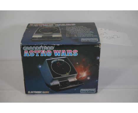 Boxed Original Astro Wars Grandstand Unit  This is an original Astro Wars Grandstand unit, a vintage electronic game from the