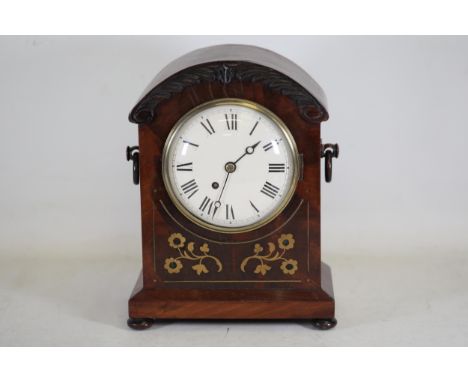 **Regency Mahogany and Brass Inlaid Mantel Clock, circa 1820** This Regency-era mantel clock, dating around 1820, is a fine e