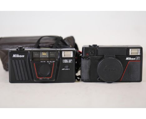**Pair of Nikon Compact Film Cameras: Models L35 AF and AF  This pair of Nikon compact film cameras comprises two distinct mo