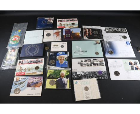 **Collection of British Commemorative Coins and Stamps Highlighting Historical Events and Figures**  This extensive collectio