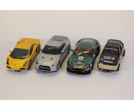 **Scalextric Slot Cars Collection: Lamborghini, Nissan GT-R, Aston Martin, and Ford**  This detailed collection includes four