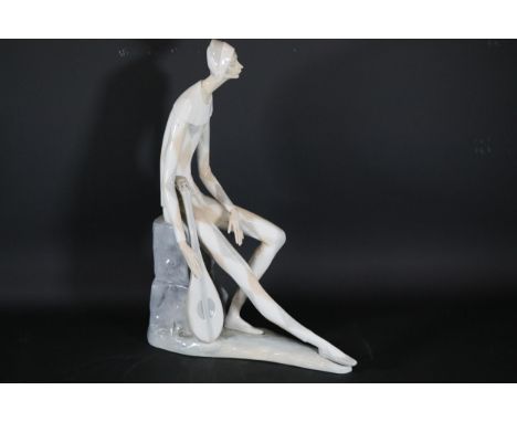 Sad Harlequin Nao Lladro Figurine with Musical Instrument (35 cm)  This exquisite figurine captures the melancholic essence o