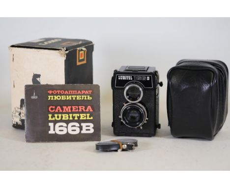 Vintage Lubitel 166B Twin-Lens Reflex Camera Set    Central to this collection is the vintage Lubitel 166B, a twin-lens refle