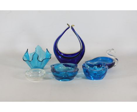 Blue Glassware Collection: Ashtrays, Vases, Handkerchief Vase (6 items)  This exquisite collection encompasses six unique blu