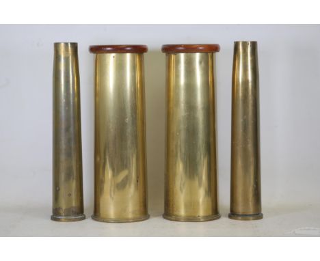Set of Four Historical Brass Military Shell Casings: 40mm and 25-Pounder Models - Approx 12" Tall  This collection features f