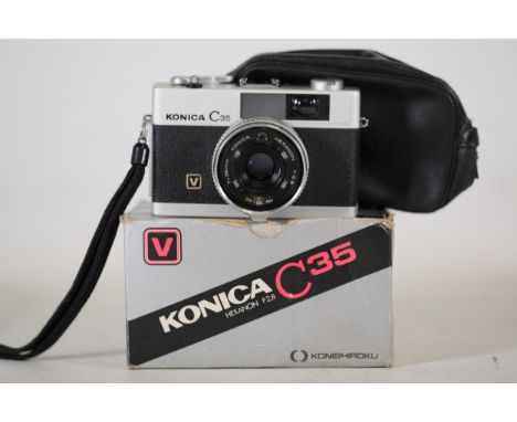 Vintage Konica C35 Rangefinder Camera with 38mm F2.8 Hexanon Lens, Box and Accessories  This lot features a vintage Konica C3