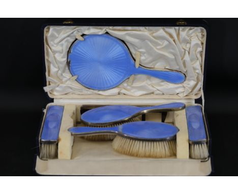 Early 20th Century Sterling Silver and Blue Enamel Vanity Set  Description:  Set in an era of luxury, this handsome set of va
