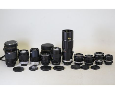 **Collection of Vintage Camera Lenses**  This remarkable collection features a diverse range of vintage camera lenses from no