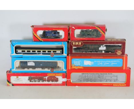 Collection of 8 Boxed Model Trains  This collection of eight boxed model trains features intricate and well-preserved items p