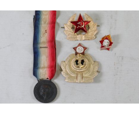 Collection of Historical Military and Commemorative Badges and Medals  This curated collection features historically signific