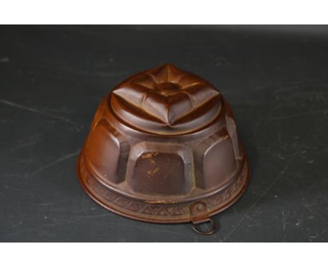 Antique Copper Jelly Mould with Intricate Pattern and Dark Patina  This exquisite antique copper jelly mould features a beaut