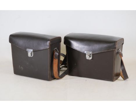 **Pair of Vintage Leitz Wetzlar Brown Leather Camera Cases** This pair of vintage Leitz Wetzlar camera cases, crafted from da