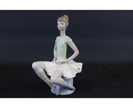 Lladró Porcelain Figurine "Laura Ballerina" by Juan Huerta, Retired in 1994This elegant Lladró figurine, titled "Laura Baller