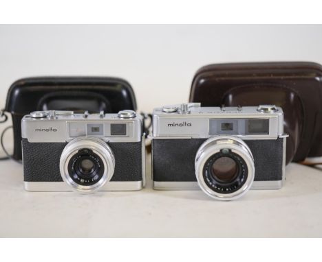 **Pair of Vintage Minolta Cameras: Minolta AL-F and Hi-Matic 7 with Cases**  This collection features a pair of vintage Minol