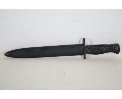 British L1A3 Bayonet with Markings and Scabbard  This British L1A3 bayonet features a black handle equipped with two screws a