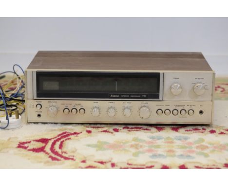 The vintage Sansui Stereo Receiver 771 features a sleek wooden case and a durable metal front panel. The control layout, span