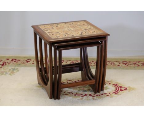 Retro Tiled Top Nest of Tables  A set of three vintage retro-style nested tables. The largest table features a decorative til
