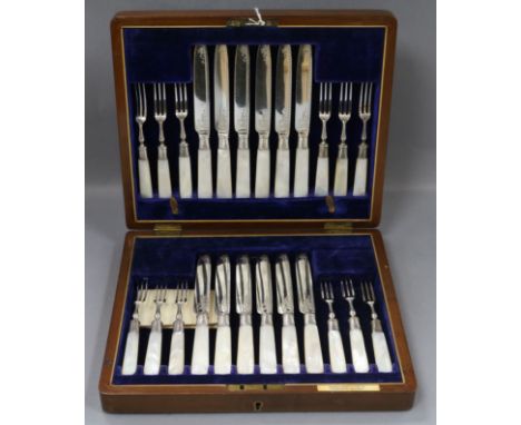 A walnut cased set of plated dessert knives and forks, with mother of pearl handles