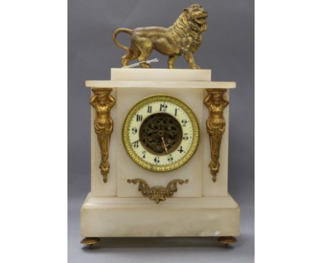 An alabaster mantel clock with gilt metal lion surmount height 37cm