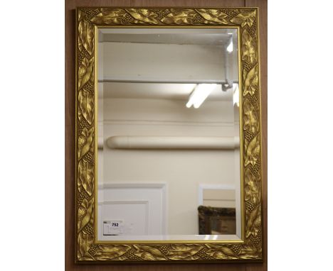 A leaf gilt wall mirror