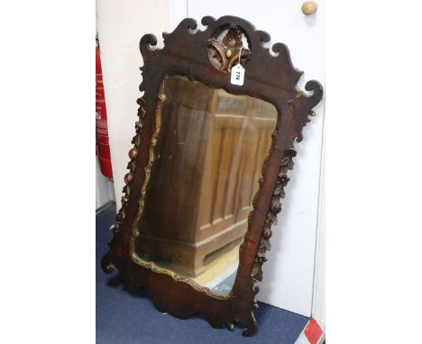 An early 18th century fret frame wall mirror W.55cm H.93cm