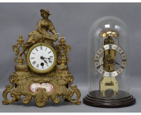 A Hermle, West Germany brass skeleton mantel clock under glass dome and a spelter figural mantel clock, the skeleton clock wi