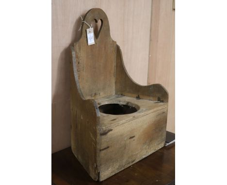 A child's Victorian pine commode chair W.43cm