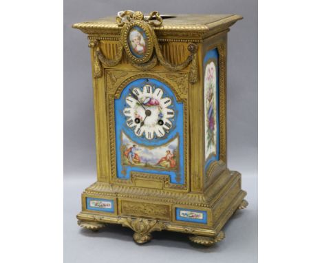 A French ormolu mantel clock with Sevres-style panels height 34.5cm
