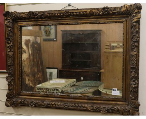 A carved giltwood framed wall mirror W.105cm H.77cm