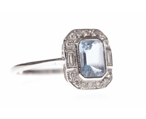 AQUAMARINE AND DIAMOND RINGset with a step cut aquamarine 6.2x4.3mm surrounded by baguette and round diamonds totalling appro