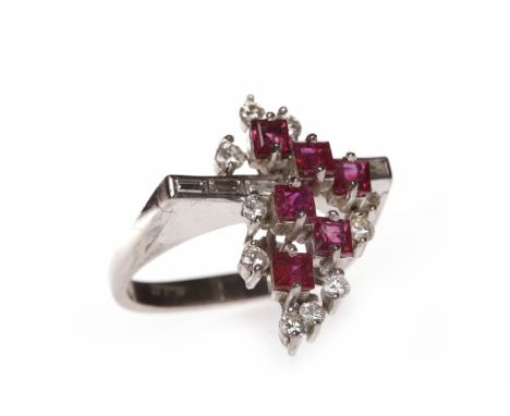 DIAMOND AND RUBY DRESS RING1970s, the tiered bezel set with square step cut rubies and baguette and round diamonds, in eighte