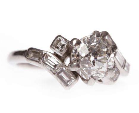 PLATINUM DRESS RINGthe central old cut stone of approximately 1.20 carats, flanked by two step cut diamonds, the twist settin