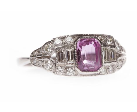 PINK SAPPHIRE AND DIAMOND RINGset with a step cut pink sapphire 5.9x4.3mm, flanked by two baguette cut diamonds to each side 