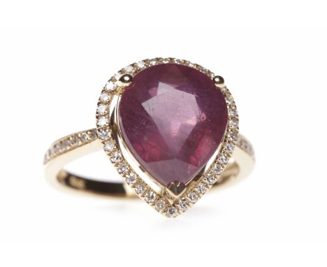 RUBY AND DIAMOND DRESS RINGset with a pear shaped ruby 11.2x9.9mm within a halo of round brilliant cut diamonds, on diamond s