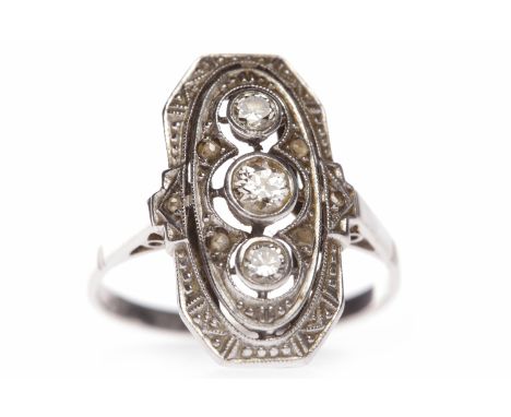 EDWARDIAN DIAMOND RINGthe oval pierced bezel 17.7mm long and set with three round brilliant cut diamonds totalling approximat