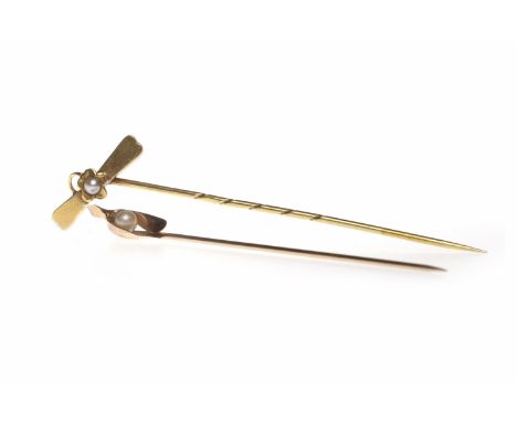 TWO EARLY TWENTIETH CENTURY STICK PINSone with a wishbone motif terminal, hallmarks indistinct, the other with a pearl set fl