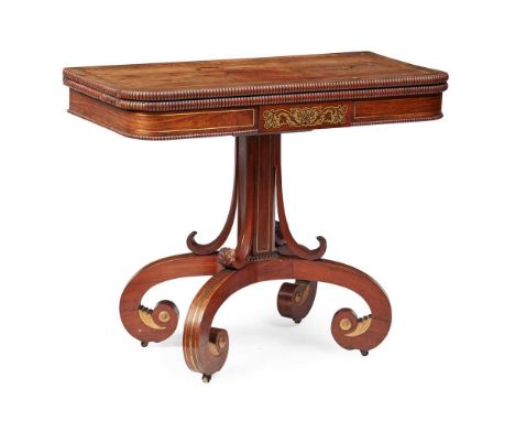 Y REGENCY ROSEWOOD, GONCALO ALVES, BRASS INLAID AND PARCEL-GILT CARD TABLE EARLY 19TH CENTURY the banded fold-over D-shaped t