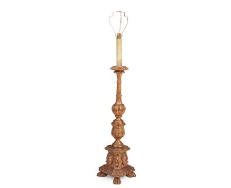 CONTINENTAL CARVED GILTWOOD PRICKET STICK LAMP 19TH CENTURY of baluster form with acanthus carved knop and triform base with 