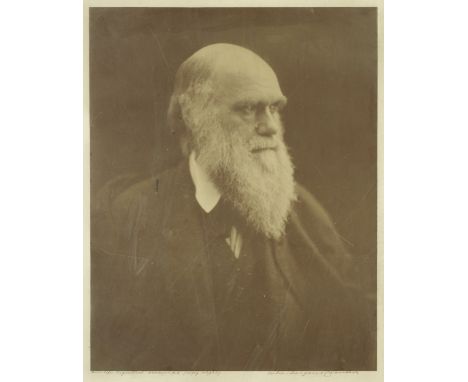 DARWIN (CHARLES)CAMERON (JULIA MARGARET) Portrait photograph of Charles Darwin, near half-length, facing left,  albumen print