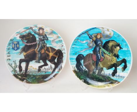 A pair of Theodore Deck circular chargers
Painted by Eugene Gluck, depicting Jeanne D'Arc each finished on a turquoise ground