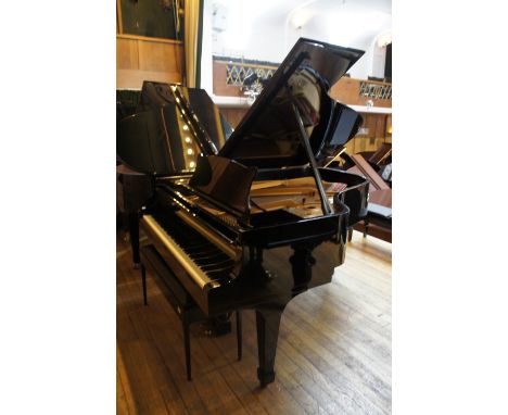 Steinway (c1960) 
A 6ft 2in Model A grand piano in a bright ebonised case on square tapered legs together with a stool.
