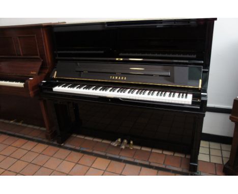 Yamaha (c2007)
A Model U3 Silent Series upright piano in a bright ebonised case.