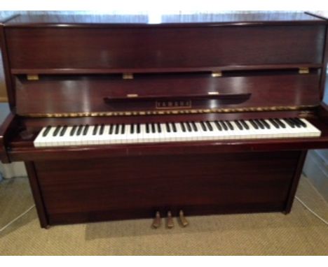 Yamaha (c1963) 
A Model P116 modern style upright piano in a bright mahogany case. 