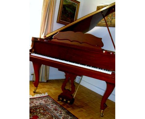 Samick (c2004) 
A 4ft 11in Model SG150  'baby' grand piano in a bright mahogany case on cabriole legs, together with a matchi