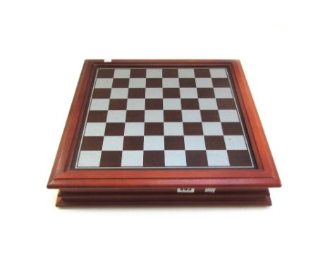A Danbury Mint 'Lord of the Rings' pewter chess set, with board, each playing piece holding a facet cut circular crystal, com