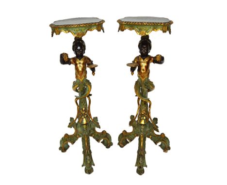 A pair of late 19th century parcel gilt polychrome painted jardinieres, modelled as standing Blackamoors, on carved tripod ba